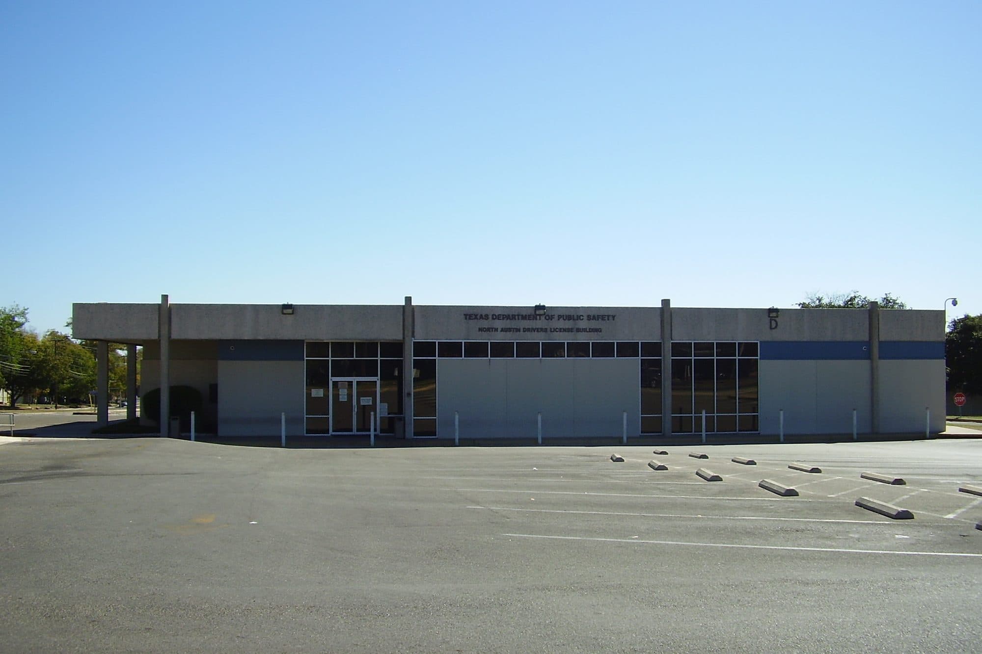 A Texas Department of Public Safety office building in North Austin with an empty parking lot out front.