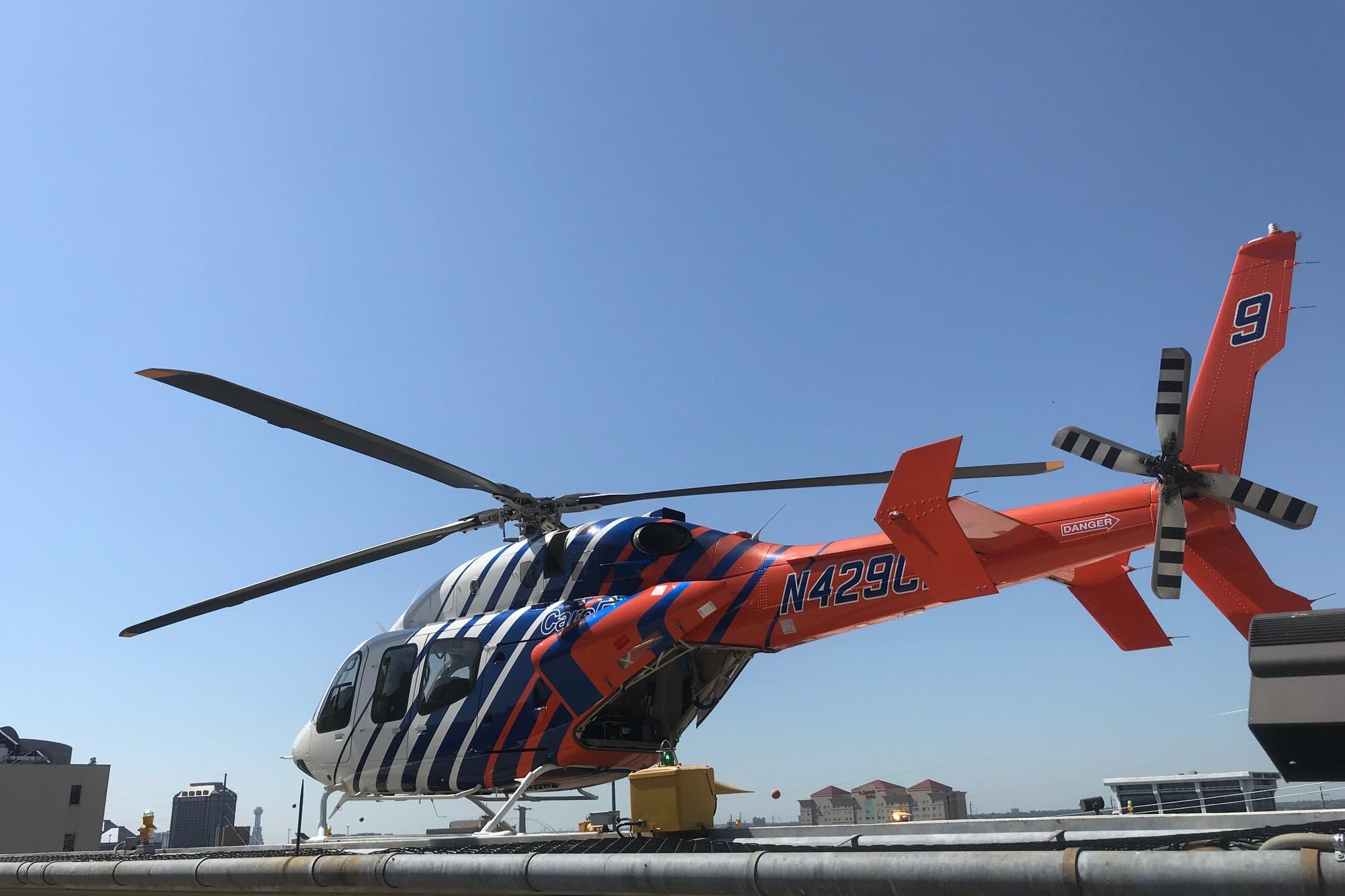 A CareFlite medical helicopter parked on the helipad at Parkland Memorial Hospital in Dallas.