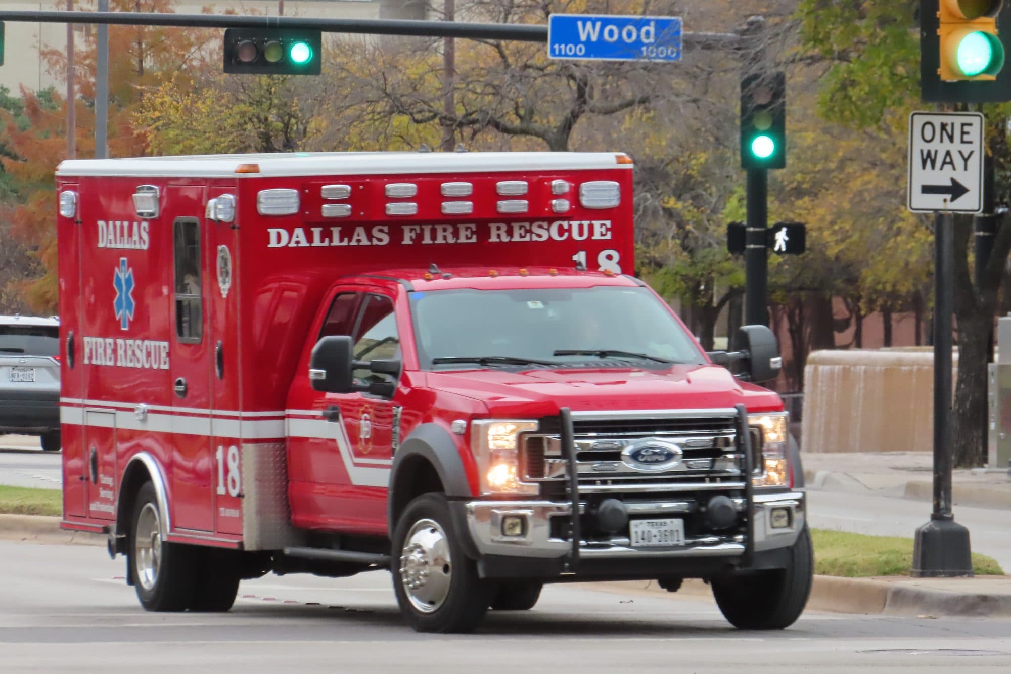 A Dallas Fire-Rescue ambulance stopped at a downtown intersection.