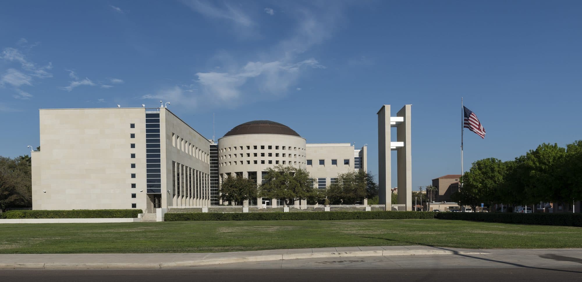 The United States Federal Building and Courthouse in Laredo, Texas, with an American flag out front.