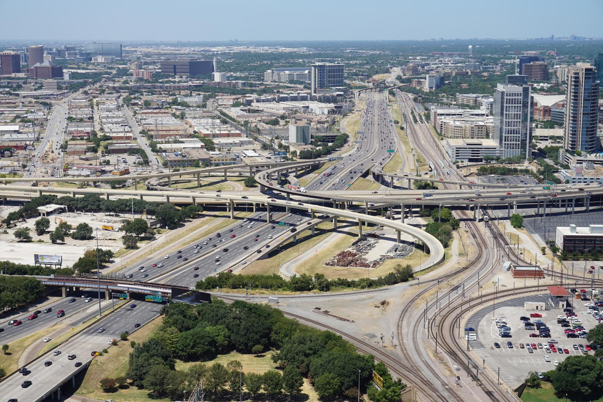 Aerial view of a large freeway interchange west of downtown Dallas, seen from Reunion Tower.